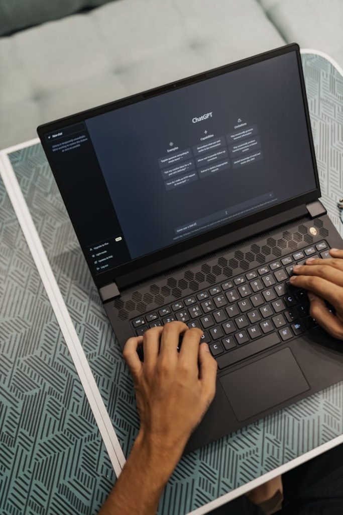 pexels photo 16094047 Person typing on a laptop with ChatGPT displayed, showcasing modern technology use.