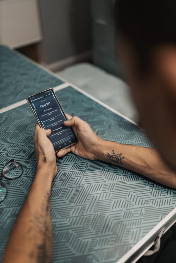 pexels photo 16094063 Man interacting with ChatGPT app on smartphone, showcasing technology in daily life.